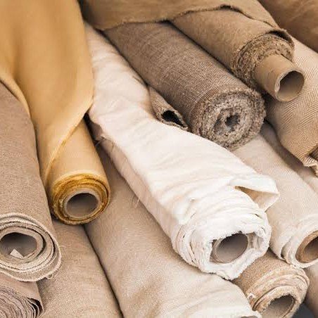 Assorted fabric rolls used for textile study in a fashion designing course